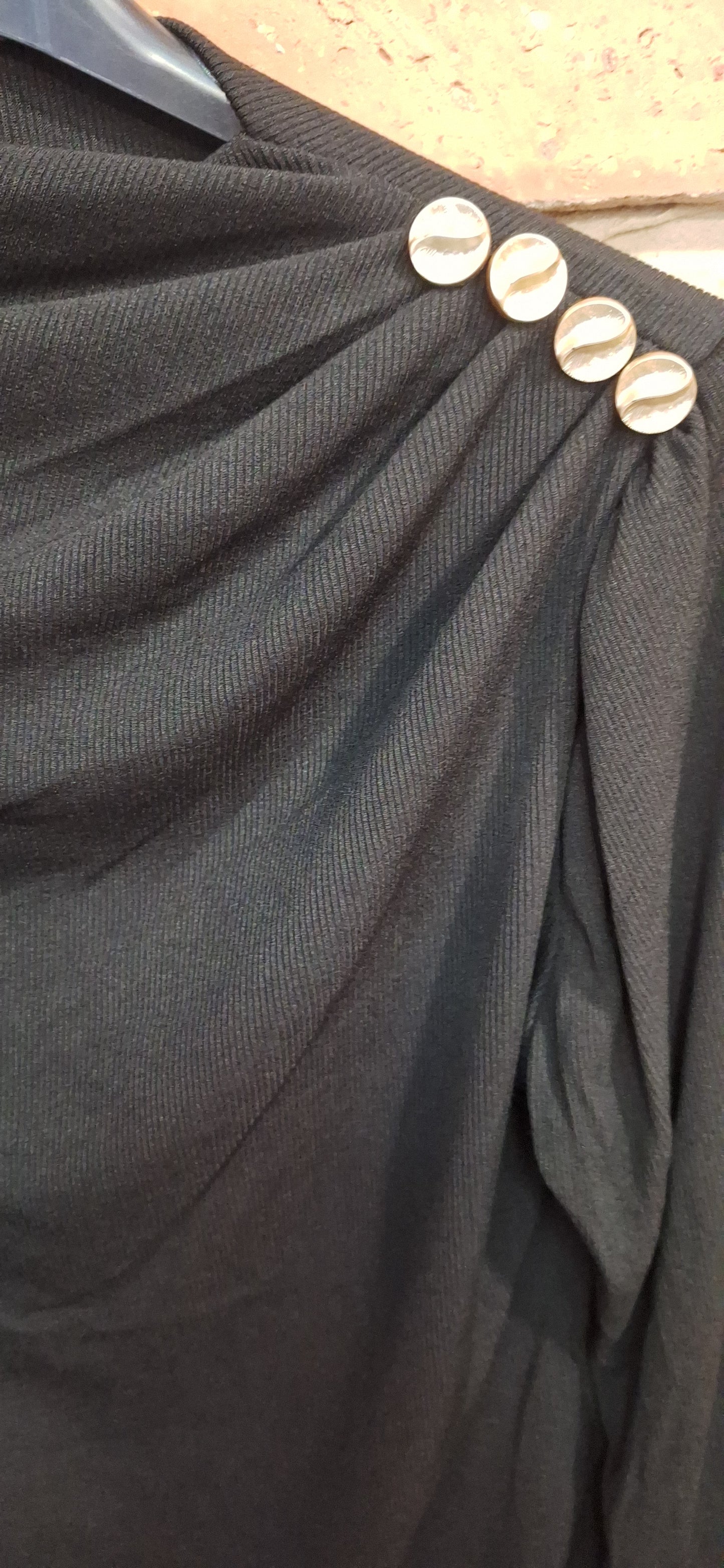 Bordázott gombos felső