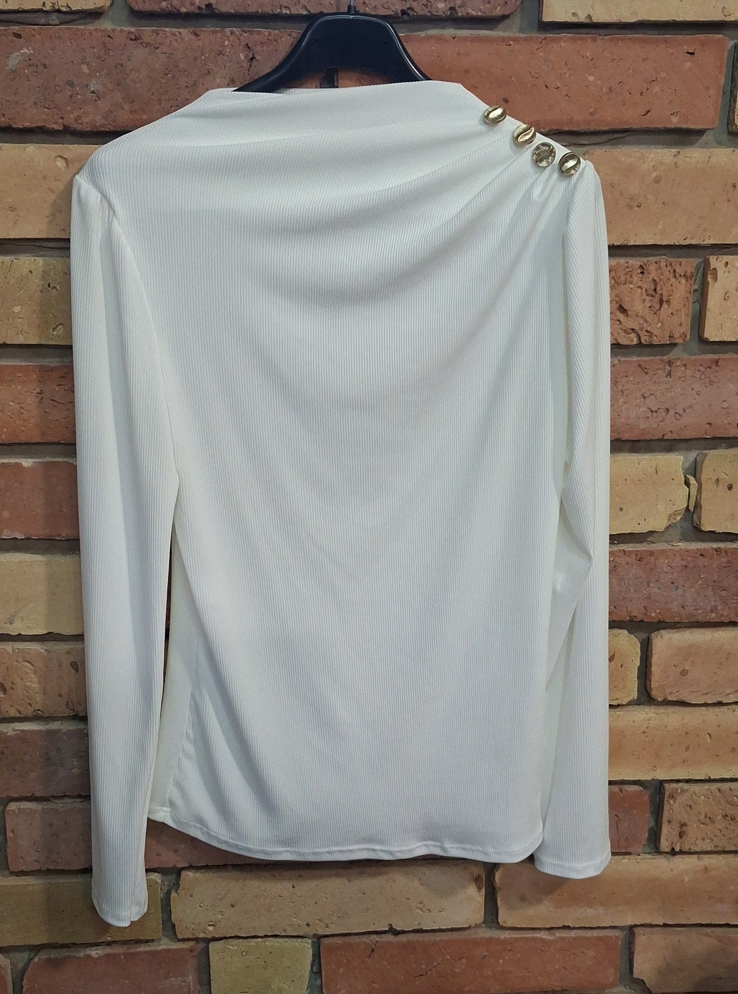 Bordázott gombos felső