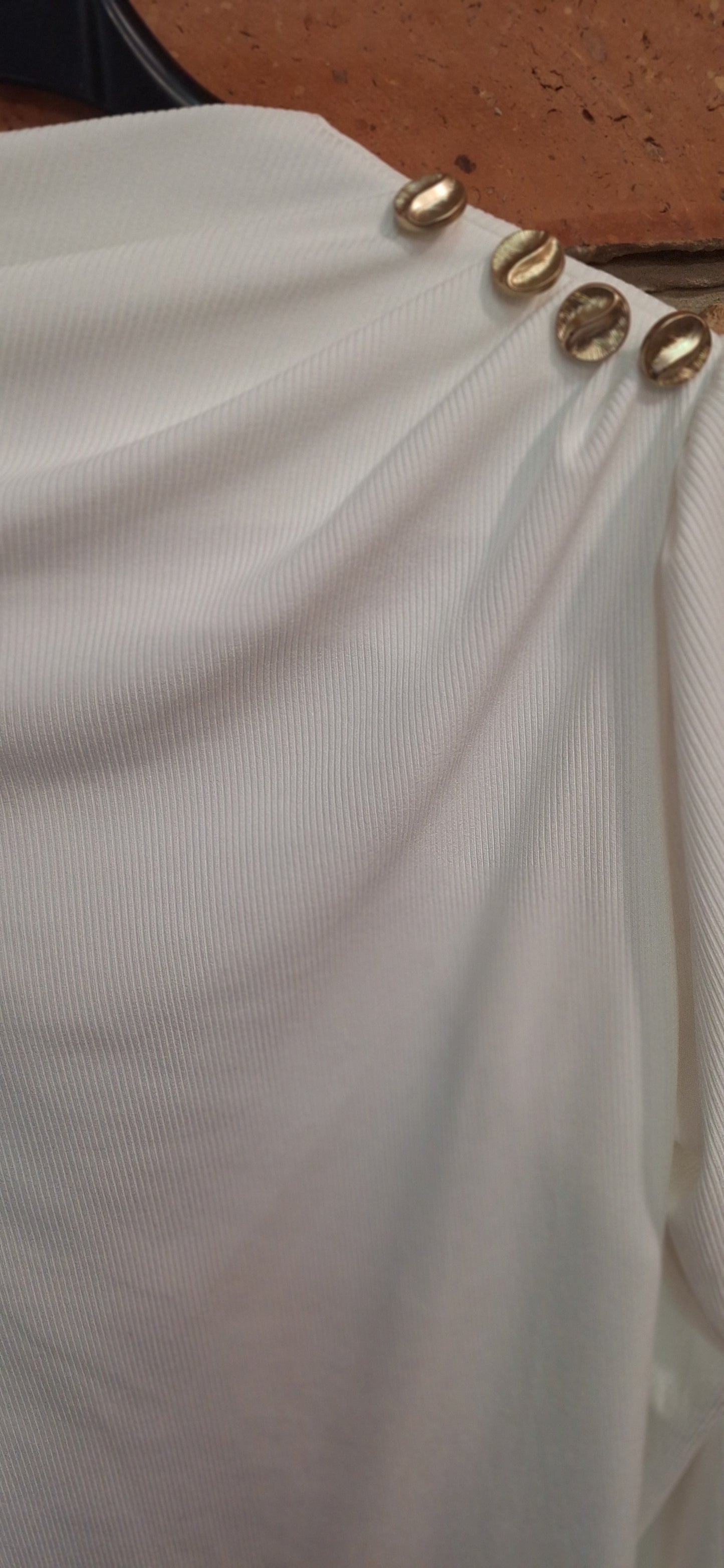 Bordázott gombos felső