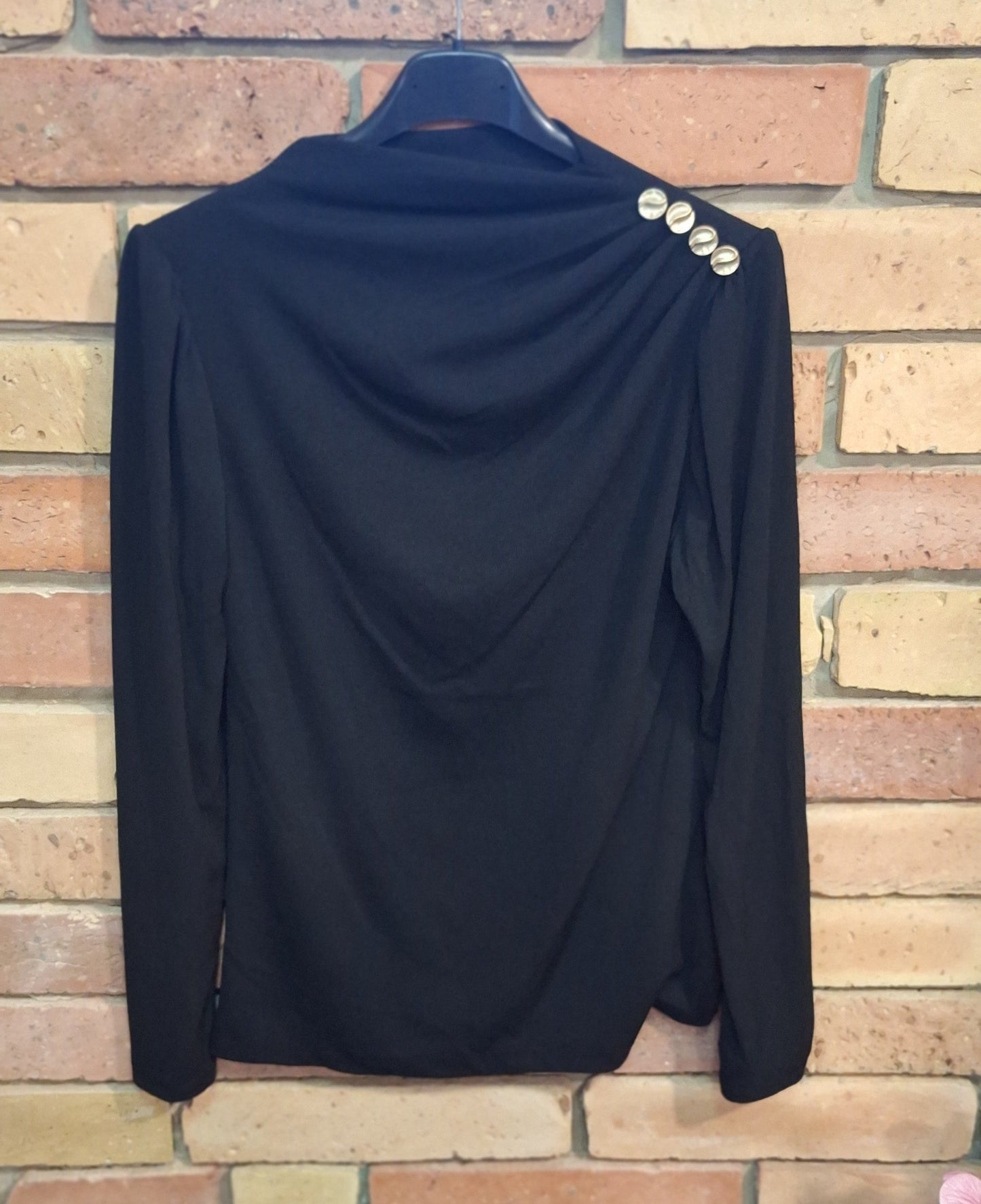 Bordázott gombos felső